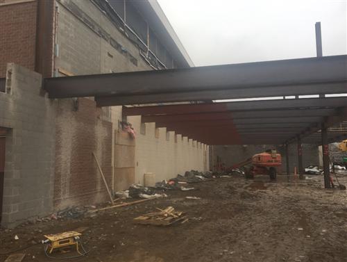 Structural Steel Being Erected South of Existing Auxiliary Gym 